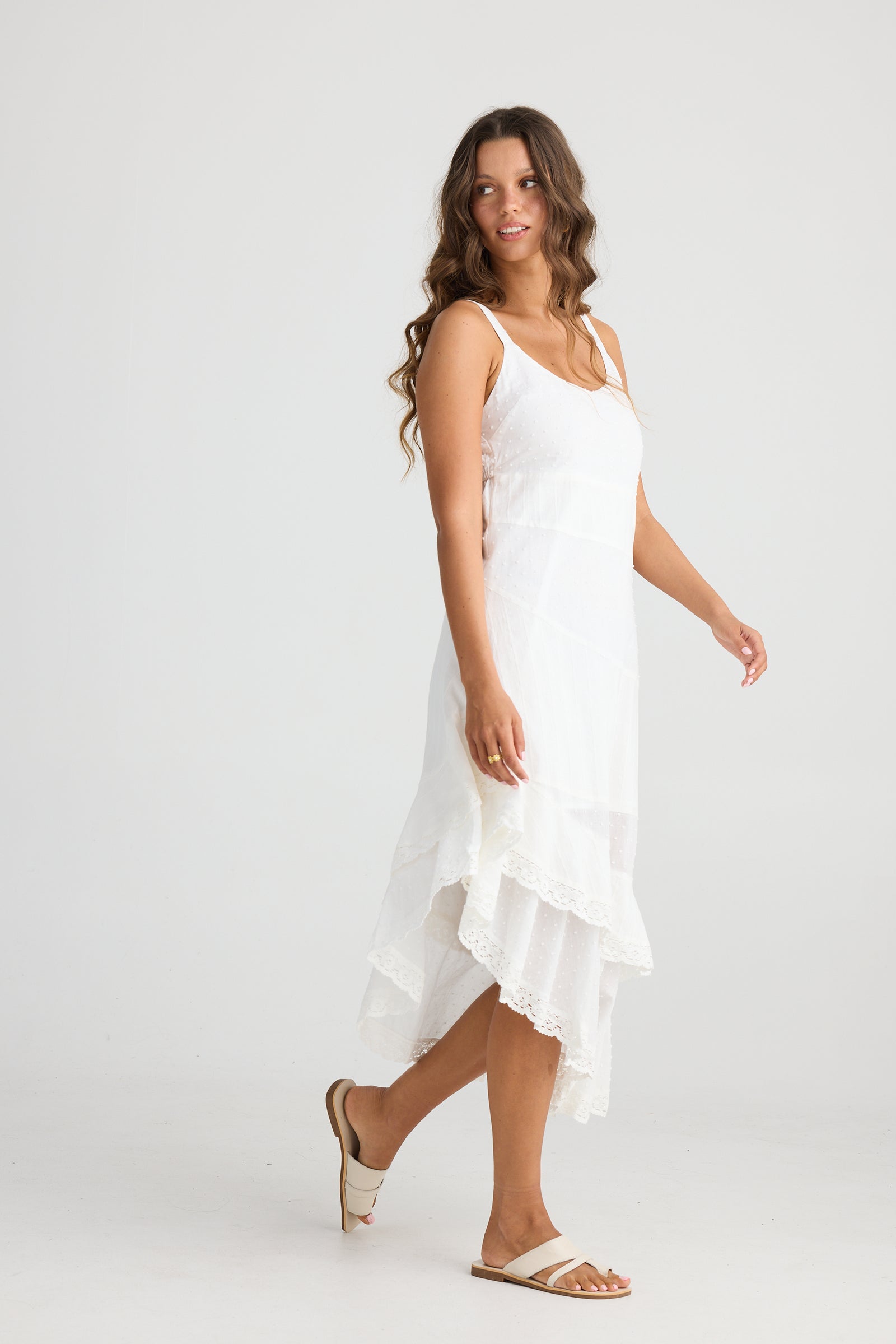 Lace Trim White Dress with Diagonal Hemline and adjustable straps by Talisman.