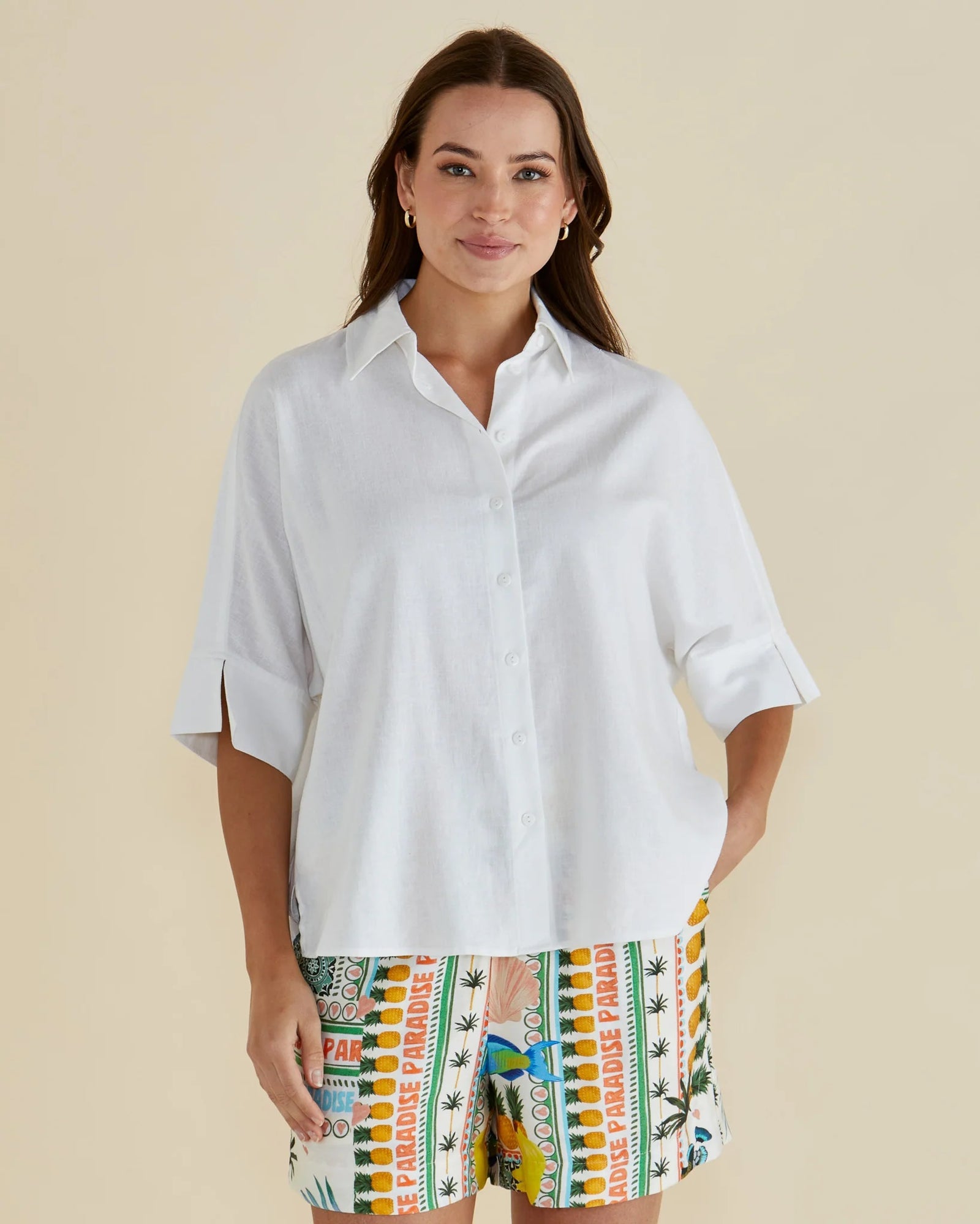 Woman wearing the betty basics Lynwood Linen Cotton Blend White Shirt with Elbow Length Sleeves, Classic collar and button up front.