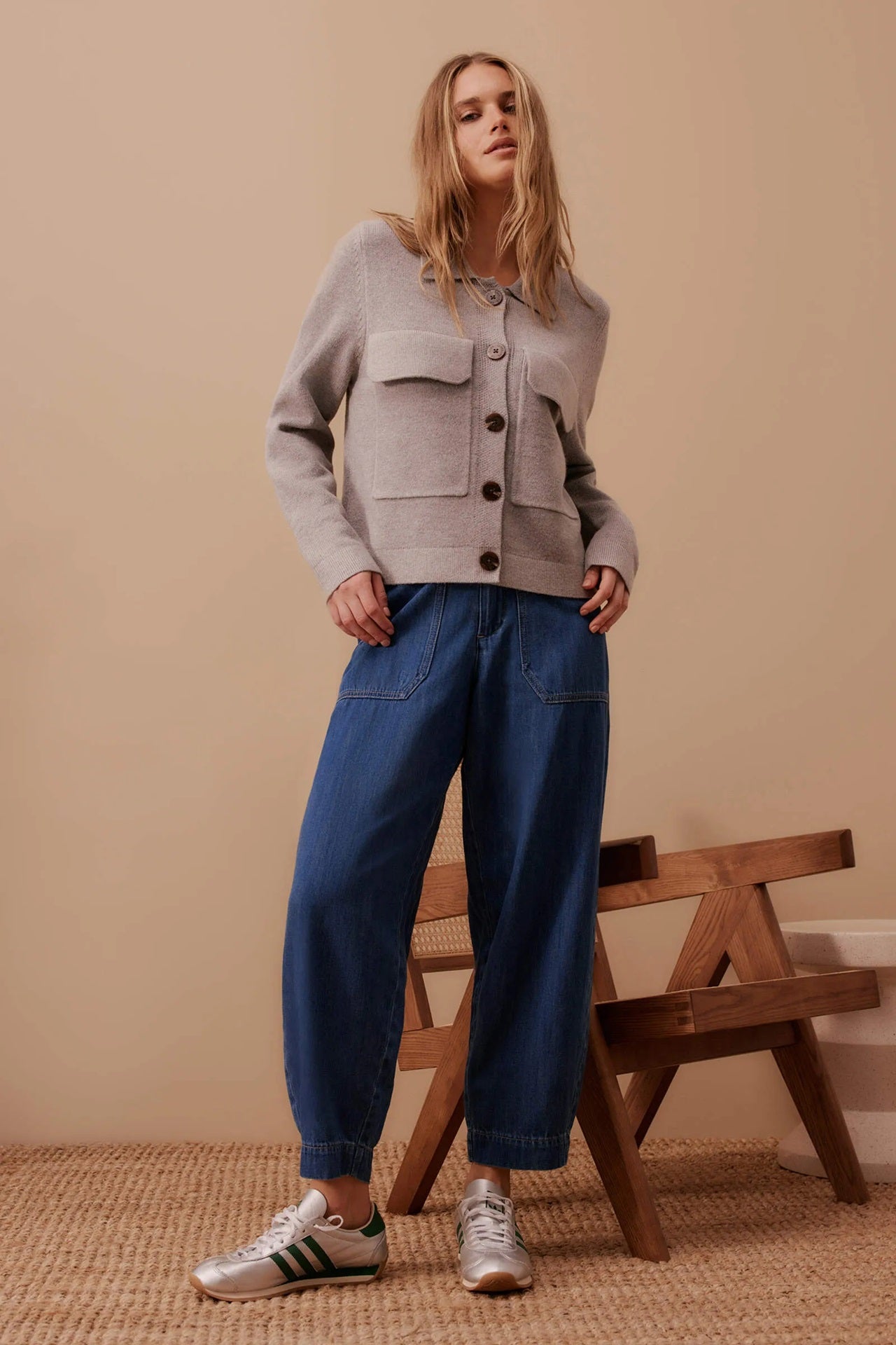 Woman wearing Ceres Life's Weekender Denim Jean Pants in Deep Indigo Blue with a full length and patch pockets.