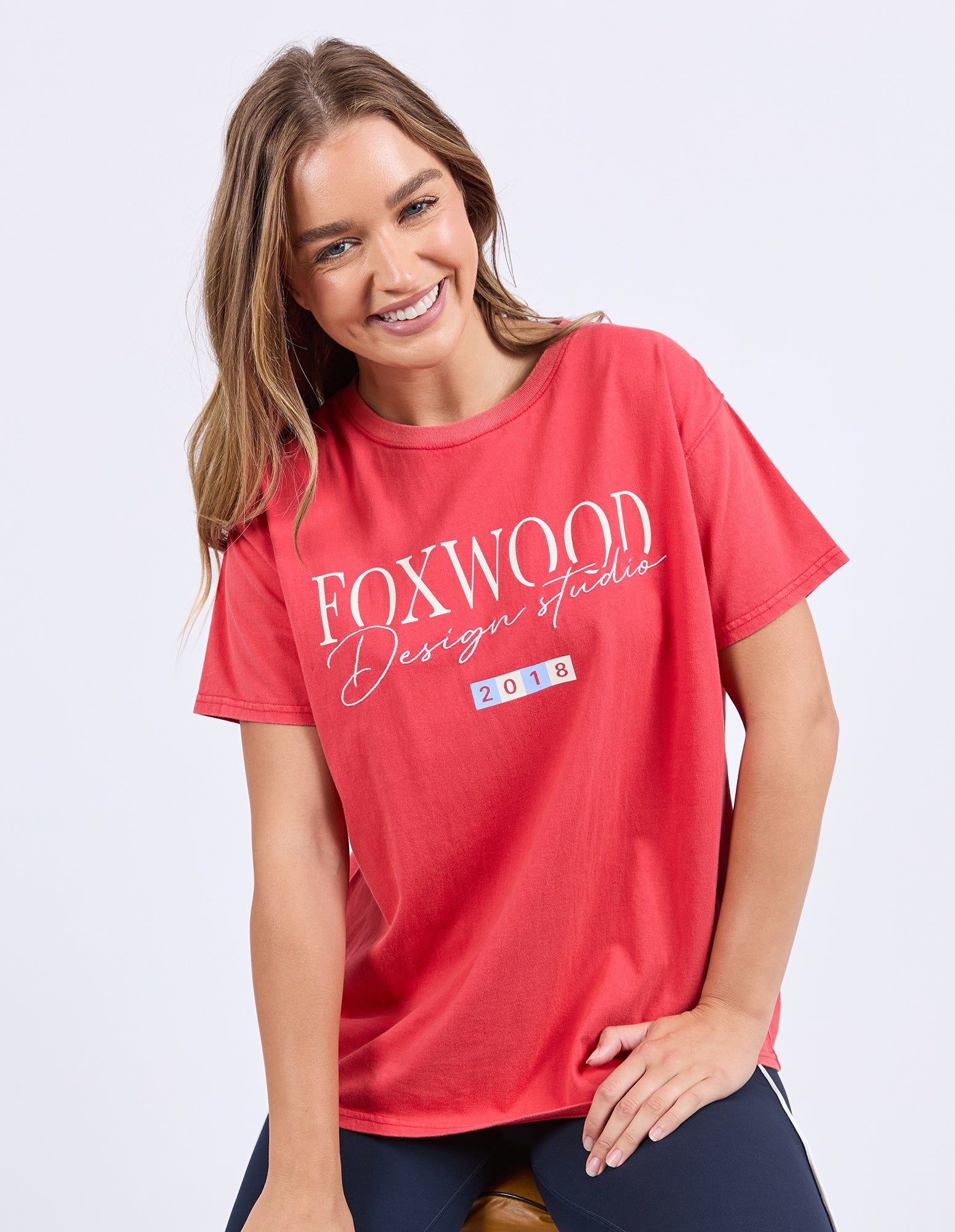 Woman wearing Foxwood's red cotton flight t-shirt with short sleeves and a crew neck.