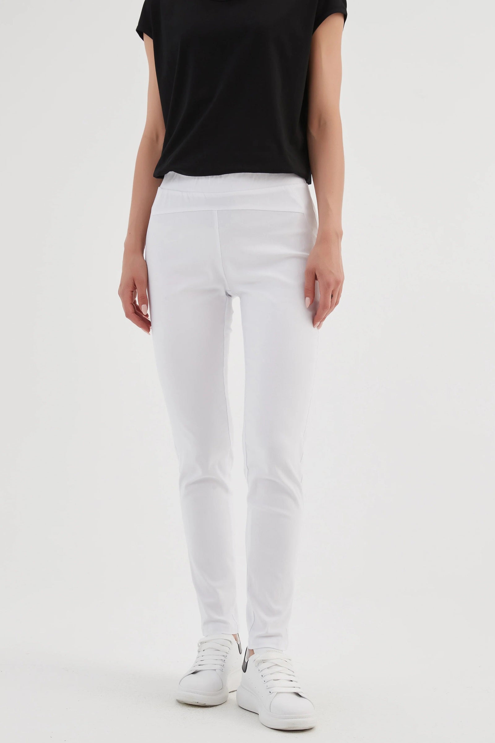 Women's fitted trousers in white with straight leg styling by Tirelli.