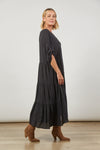 side view of Euphoria button V-neck tiered maxi dress with long sleeves rolled up in a tab  from Isle of Mine