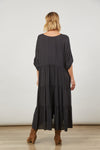 Back View of black Onyx maxi tiered dress with long tabbed sleeves by Isle of Mine