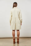 back view of urban shirt style dress in cream from isle of mine. 3 tiers with sligth gathering, long slight balloon sleeves with cuff and button.