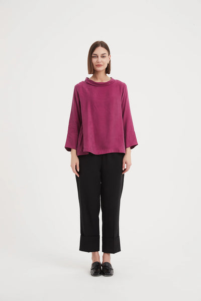 Tirelli long bell sleeve top in fuchsia pink and a mock turtle neck