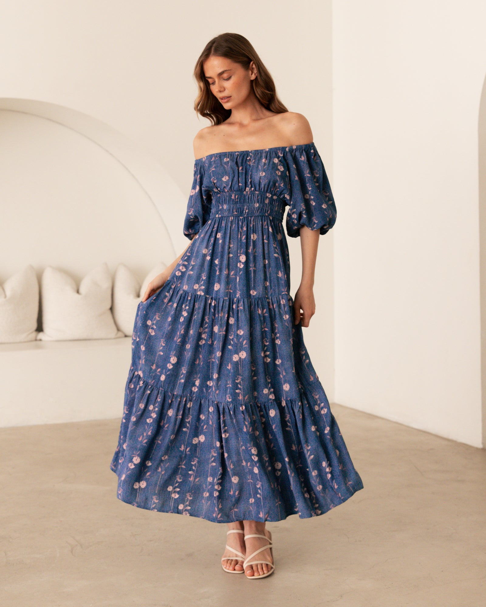 Woman wearing the Ebby & I Sweet Sensations maxi dress with puff sleeves, on or off shoulders, gathering under bust and tiered skirt.