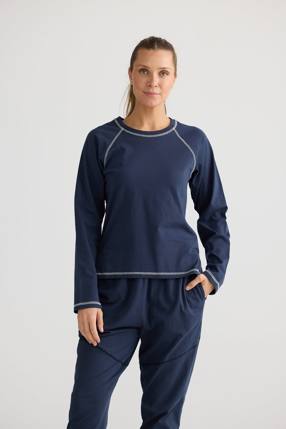 Duplex Top a Navy Blue Fitted Top with Contrast stitching and long sleeves by Holiday.