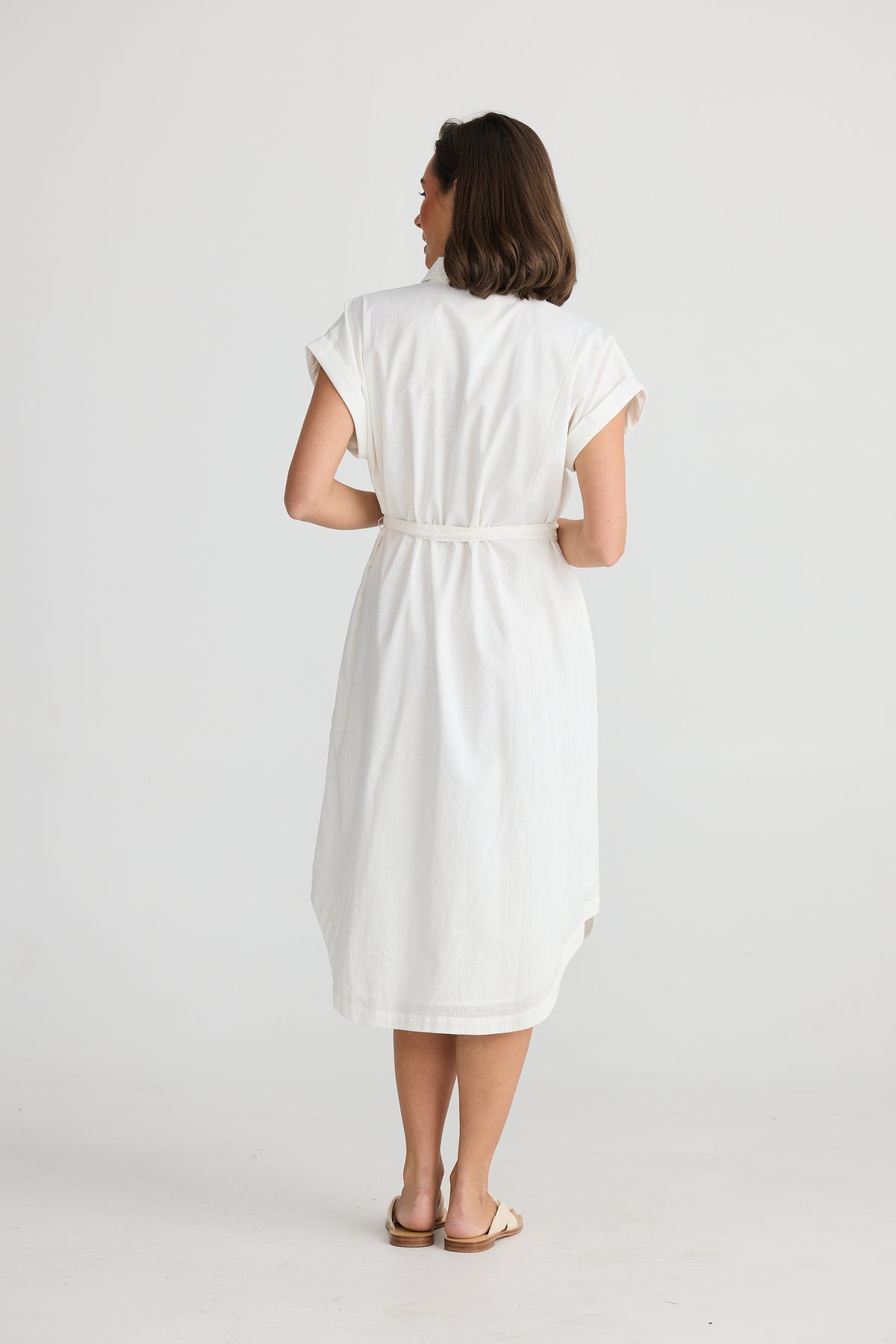 Back of White Shirt Dres wtih Short sleeves tie waist and rounded hem by holiday Trading.