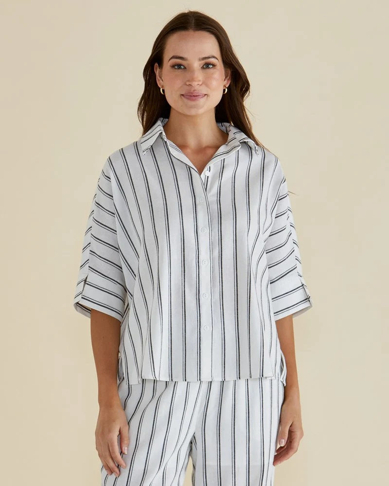 Woman wearing the betty basics Lynwood Linen Cotton Blend White Shirt with Elbow Length Sleeves, Classic collar and button up front.