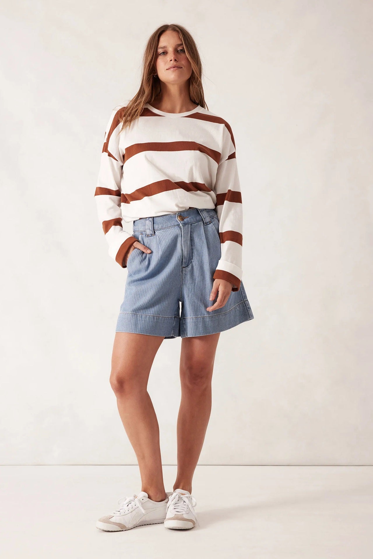 Woman wearing the Billy Herringbone Blue Pleat Front Shorts by Ceres Life.