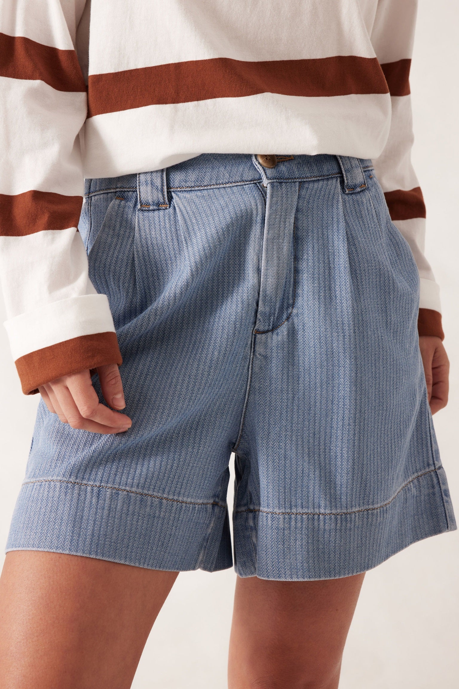 Woman wearing the Billy Herringbone Blue Pleat Front Shorts by Ceres Life.