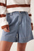 Woman wearing the Billy Herringbone Blue Pleat Front Shorts by Ceres Life.