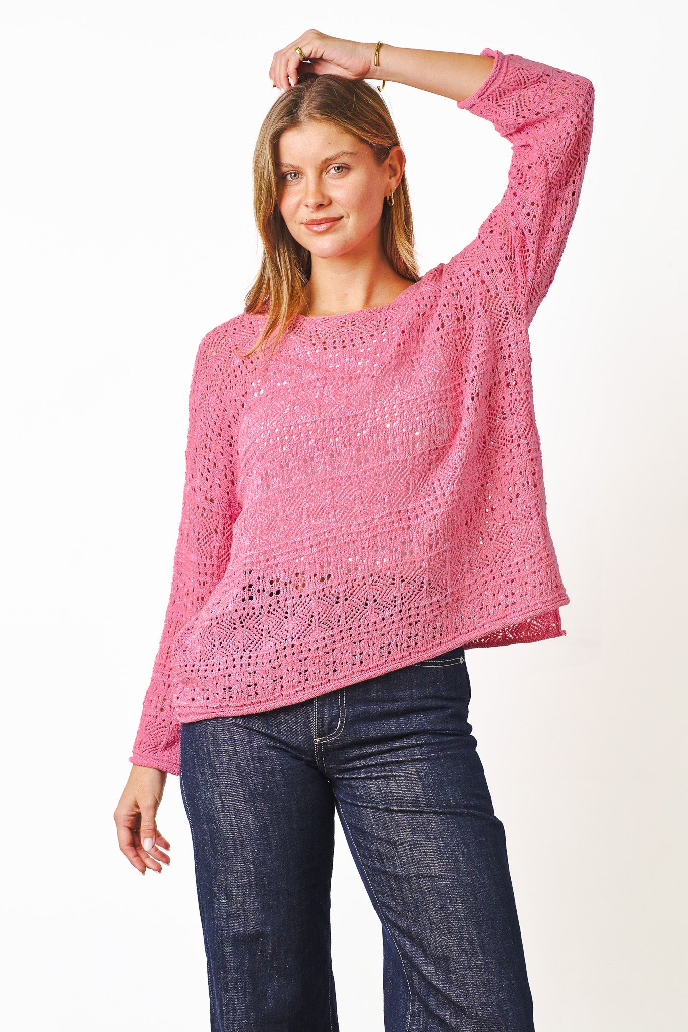 Woman wearing open knit lightweight Flynn Knit Top in Pink by Boho Australia.