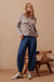 Woman wearing Ceres Life's Weekender Denim Jean Pants in Deep Indigo Blue with a full length and patch pockets.