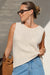 Woman wearing a beige ecru off white sleeveless knit tank top by Ceres life.