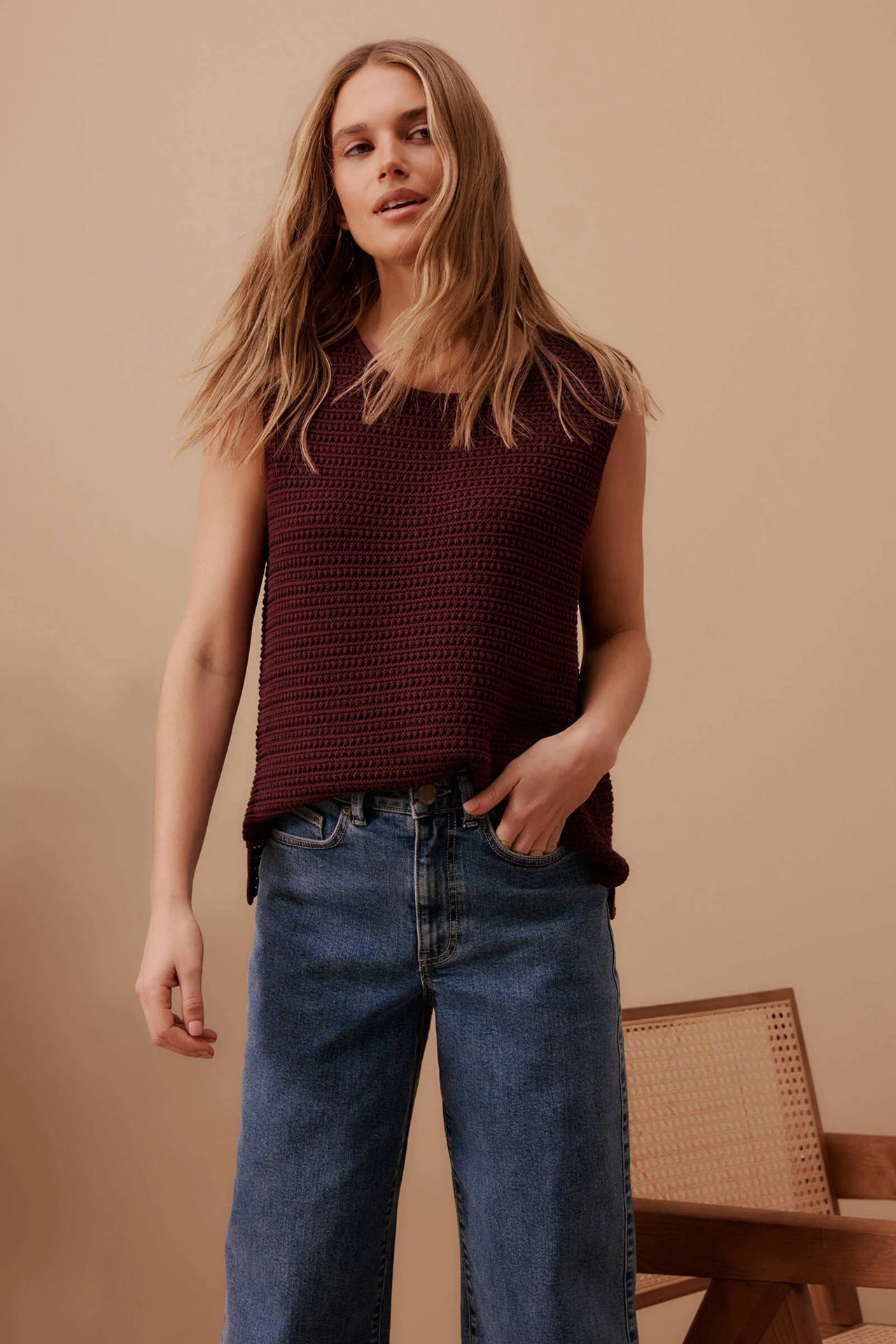 Woman wearing wine brown sleeveless Margot knit mesh tank top  by Ceres life.