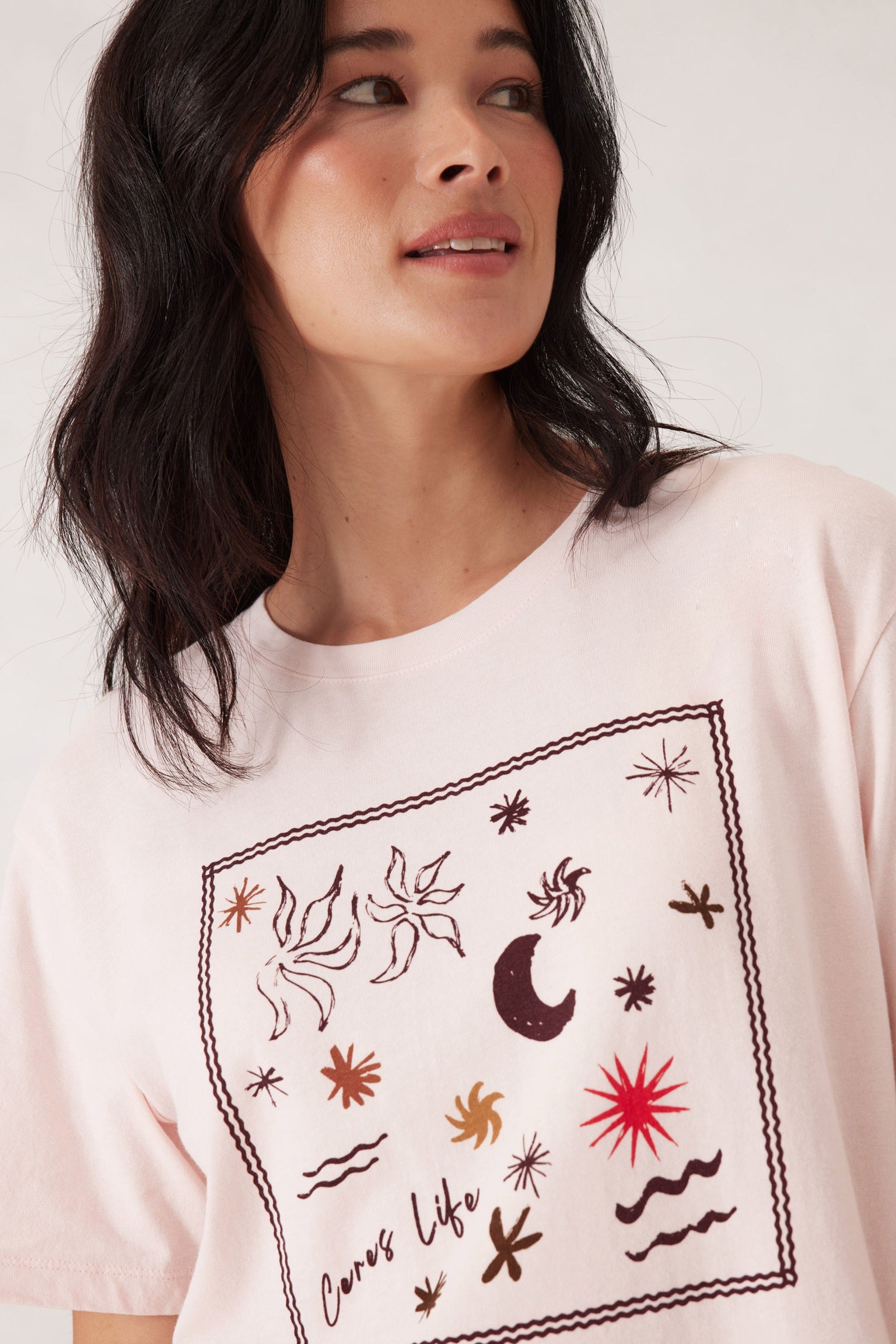 Woman wearing the relaxed fit Stevie Slouch Tshirt in shell pink with berry scarf print by Ceres Life.