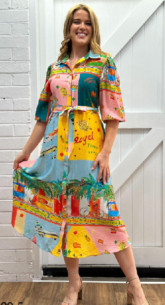 Woman wearing chicken on a Bike print shirt dress from Sambara in multi.
