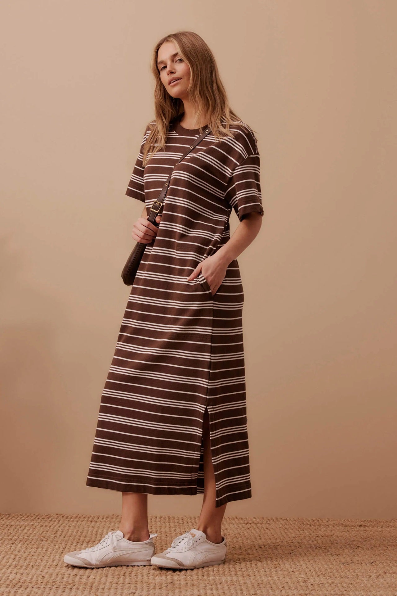 Woman wearing Ceres Life's Charlotte Maxi Dress in chocolate and white stripes with side splits, short sleeves and round neck in terry cotton.