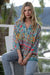 Model wearing Cienna's boho Carmen geometric multi shirt with long sleeves.