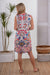 Lady wearing Cienna's Cross Stitch Midi Shirt Short Dress in White, blue red and pink with a v-neck, sleeveless and button front.