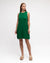 Woman wearing an emerald green knit sleeveless midi / mini dress by Paper Heart.