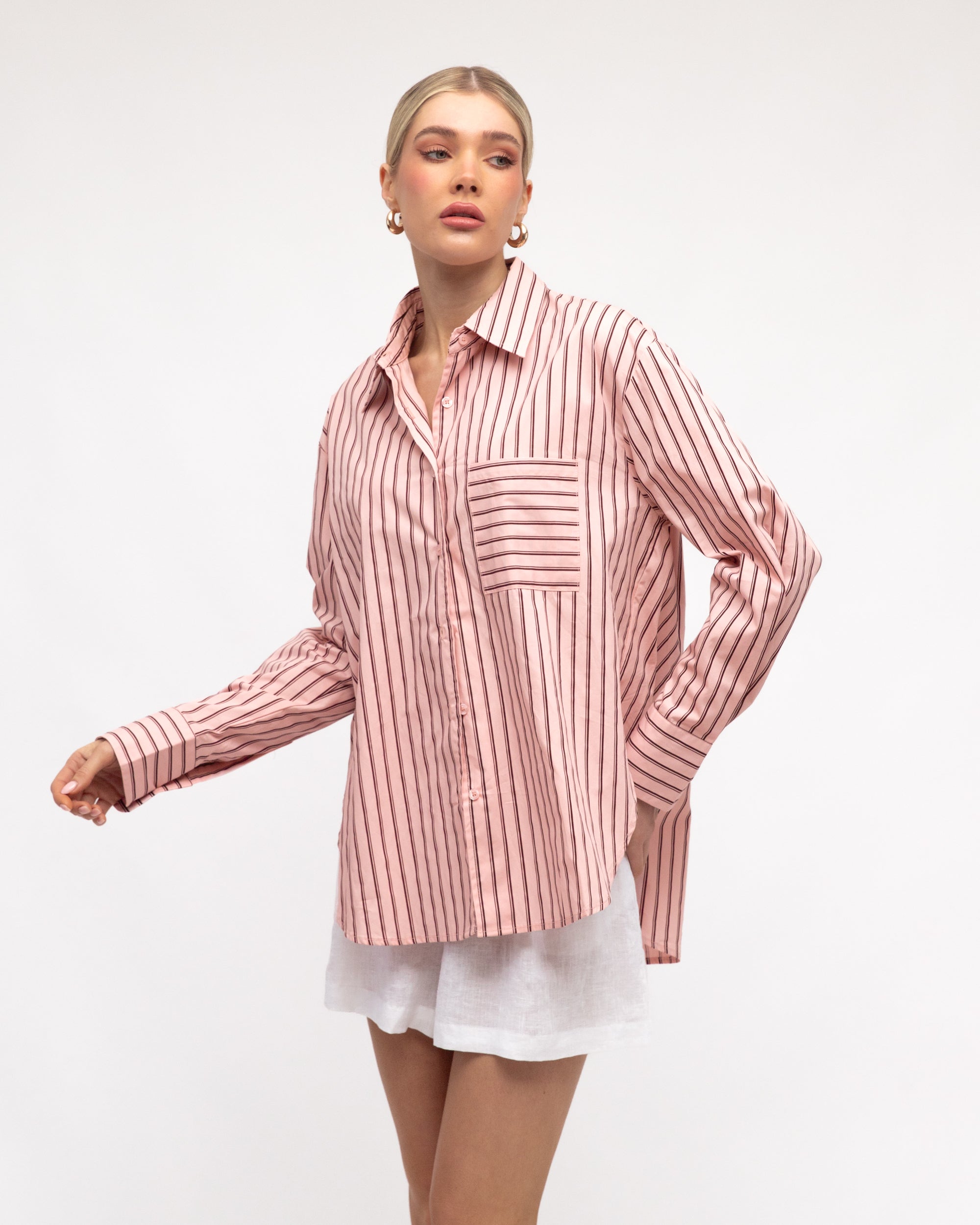 Woman wearing White Closet's long sleeve Francine Stripe Shirt in Cream and Brown.