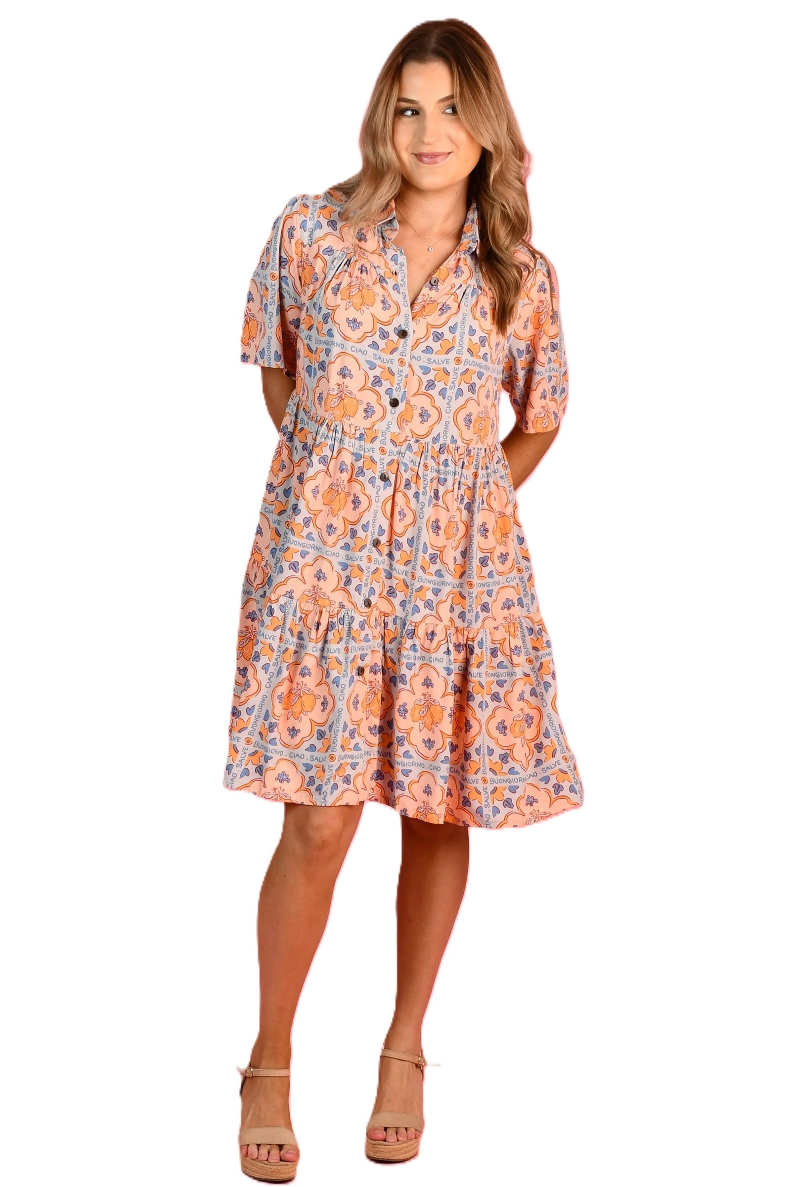 Woman wearing Go Girl's Victoria Midi Button Up Dress in Lemon Tile Pink, Blue and White with Short sleeves and a tiered skirt it falls at knee length.