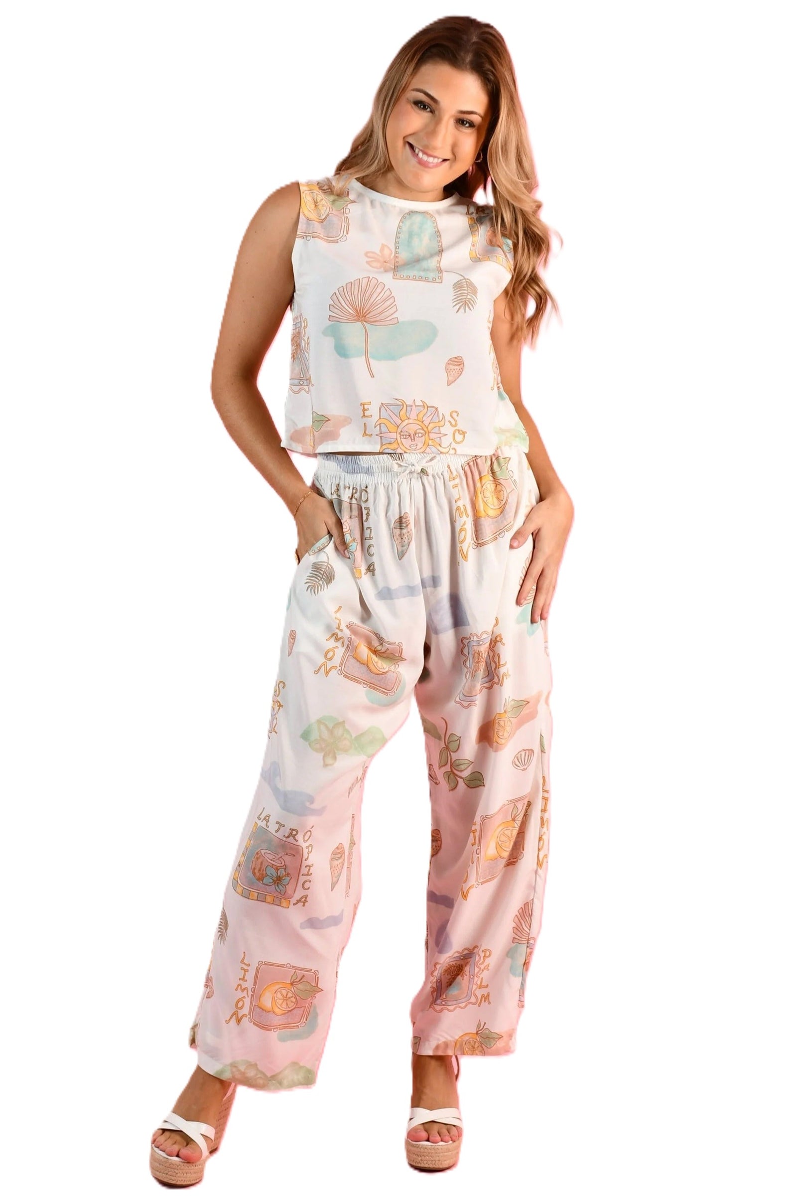 Woman wearing the Yacht Long pants in Zesty postcoard a full length relaxed fit pant with elasticated waist and fun print in blue, green, white and yellow by Go Girl.