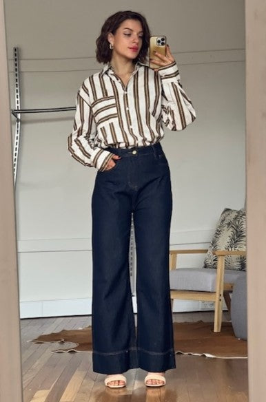 Woman wearing the White Closet Indigo Hues Wide Leg jeans.