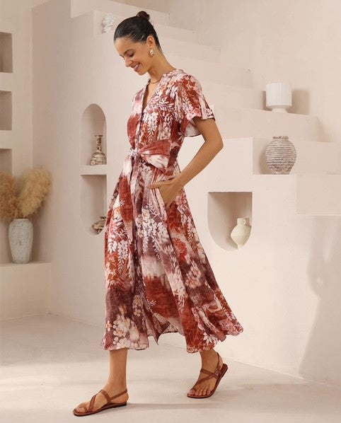 Woman wearing the leafy Rylee Tie Front or Back Dress with button up front, short sleeves, vneck and is oh so pretty from Iris Maxi.