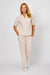 woman wearing the la strada beige blink pocket patch pants, full length with a straight leg.