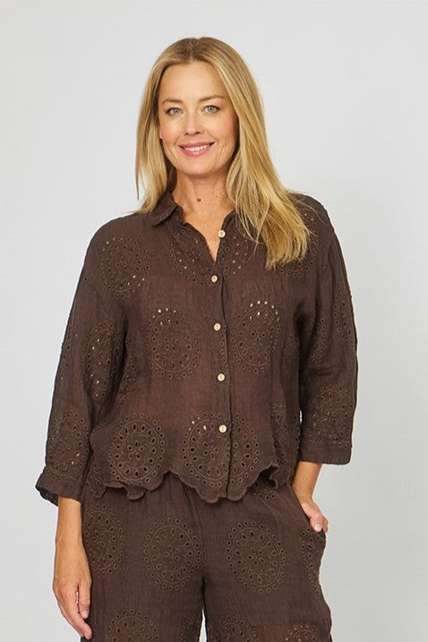 Woman wearing the chocolate broderie anglaise shirt with 7/8 sleeves and classic collar from La Strada.
