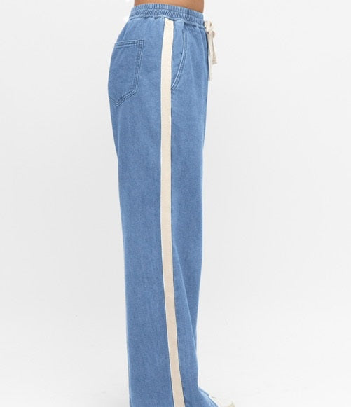 Model wearing Label of Love Cream Side Stripe Jeans with Pull on Style elasticated waist, pockets and full length.