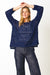 Woman wearing open knit lightweight Flynn Knit Top in Pink by Boho Australia.