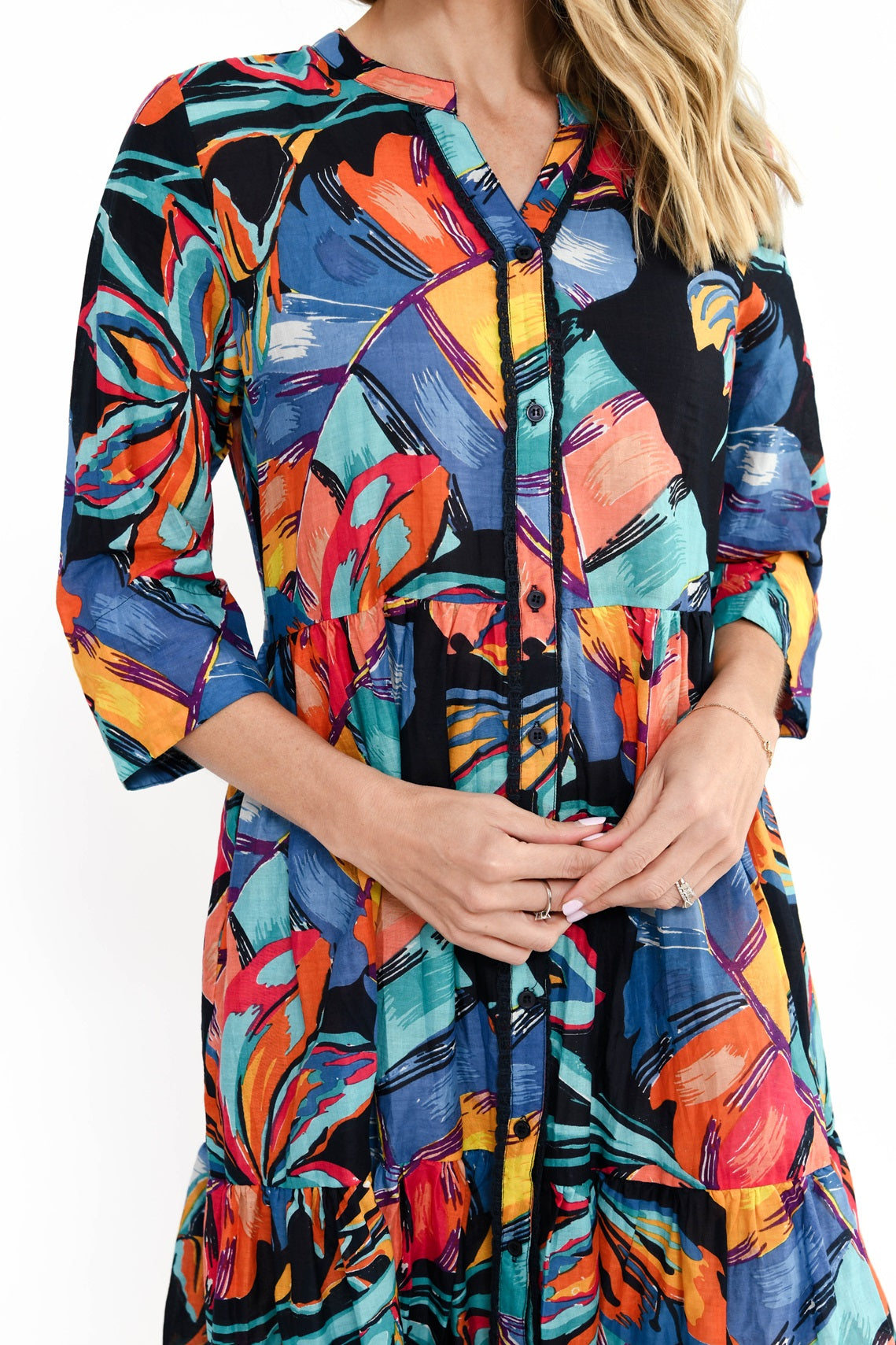 Woman wearing the Vivian multi coloured midi button up dress with a v-neck grandpa collar and knee length by One Summer.