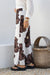 Woman wearing floral brown Shona Pants in smoky chocolate by Jatea.