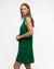Side view of woman wearing emerald green knit midi dress.