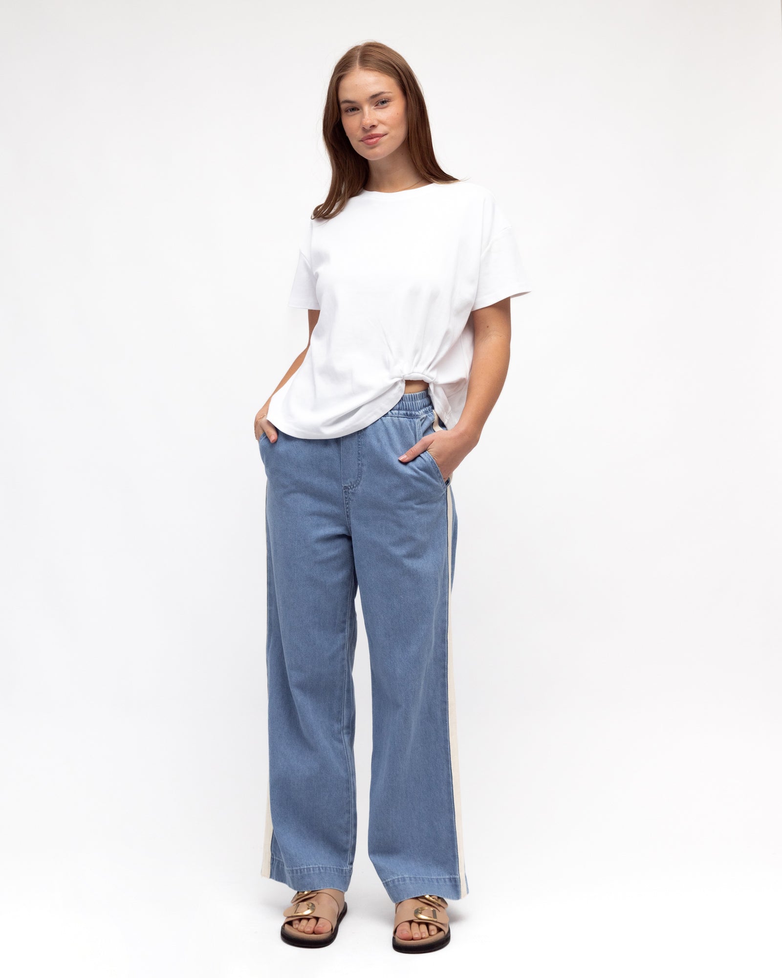 Model wearing Label of Love Cream Side Stripe Jeans with Pull on Style elasticated waist, pockets and full length.