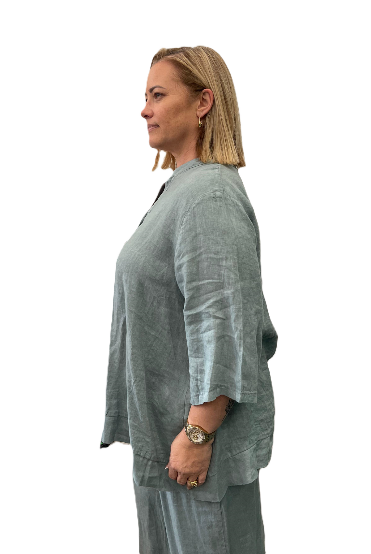 Side View of Aversa Linen blouse in blue wtih 3/4 sleeves and a relaxed fit.