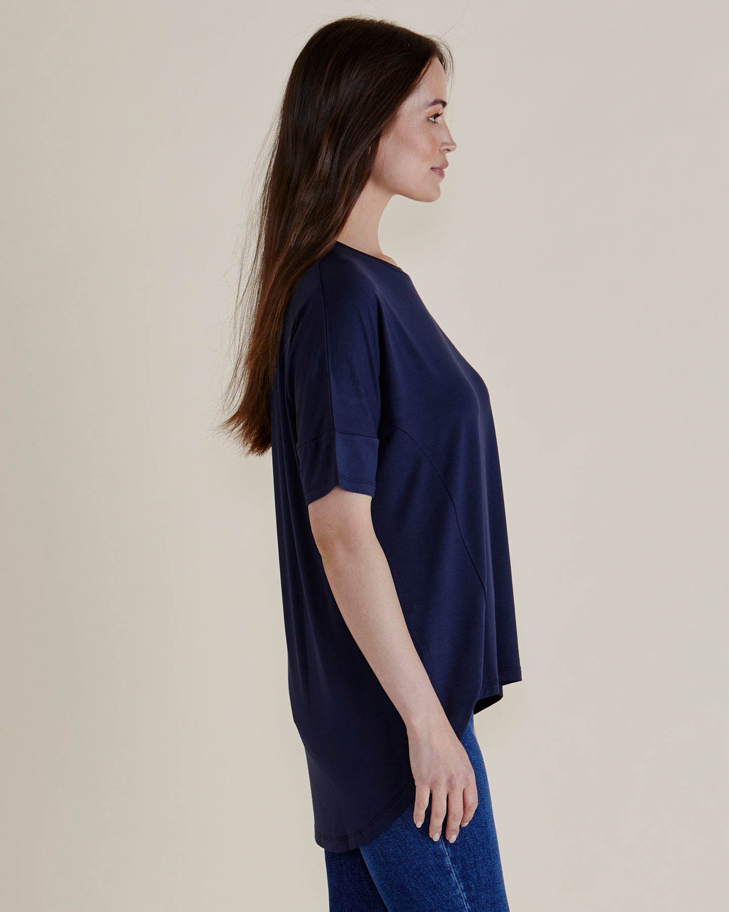 Lady wearing Betty Basics Romona Relaxed Bamboo Short sleeved tshirt in  Navy blue.