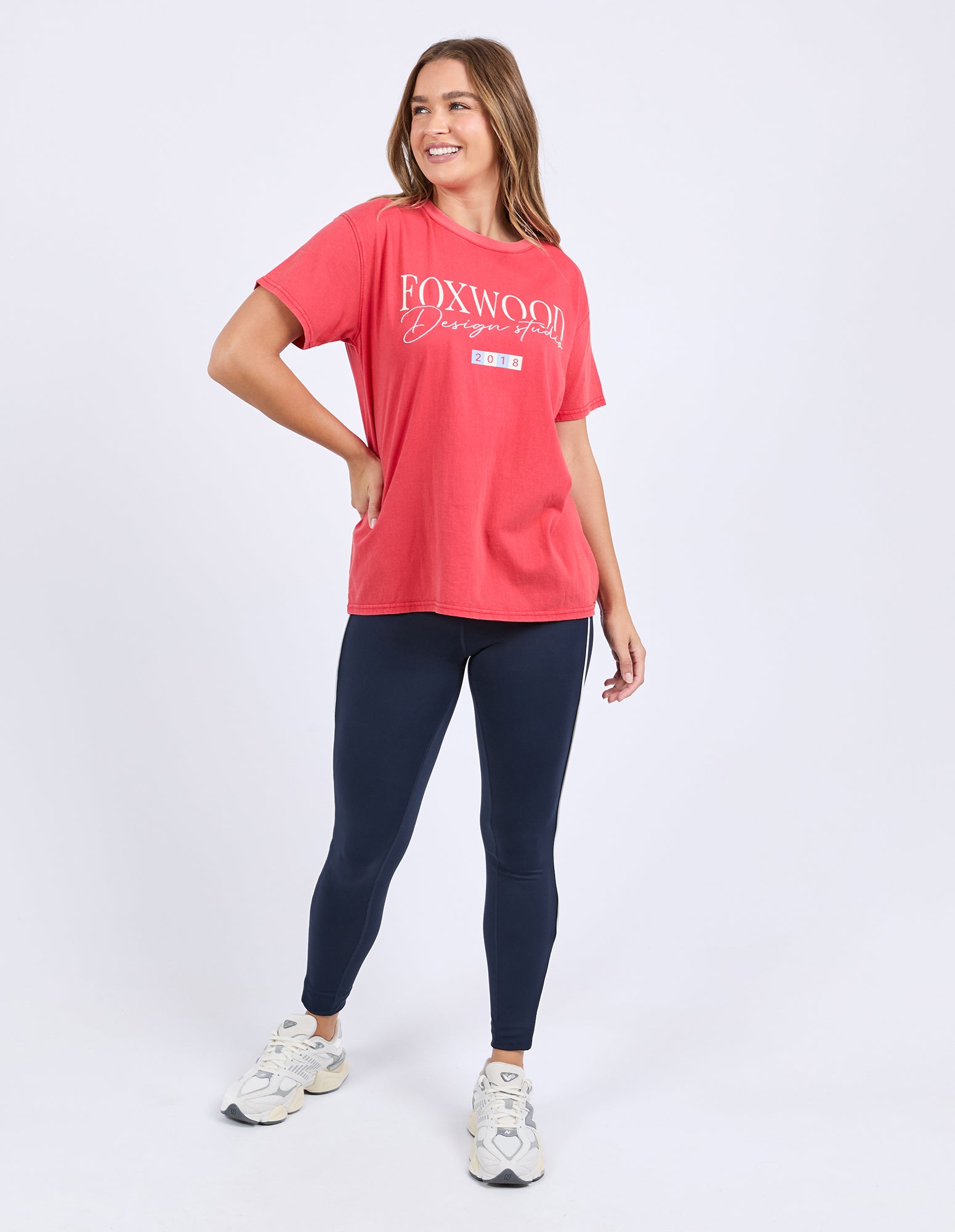 Woman wearing Foxwood's red cotton flight t-shirt with short sleeves and a crew neck.