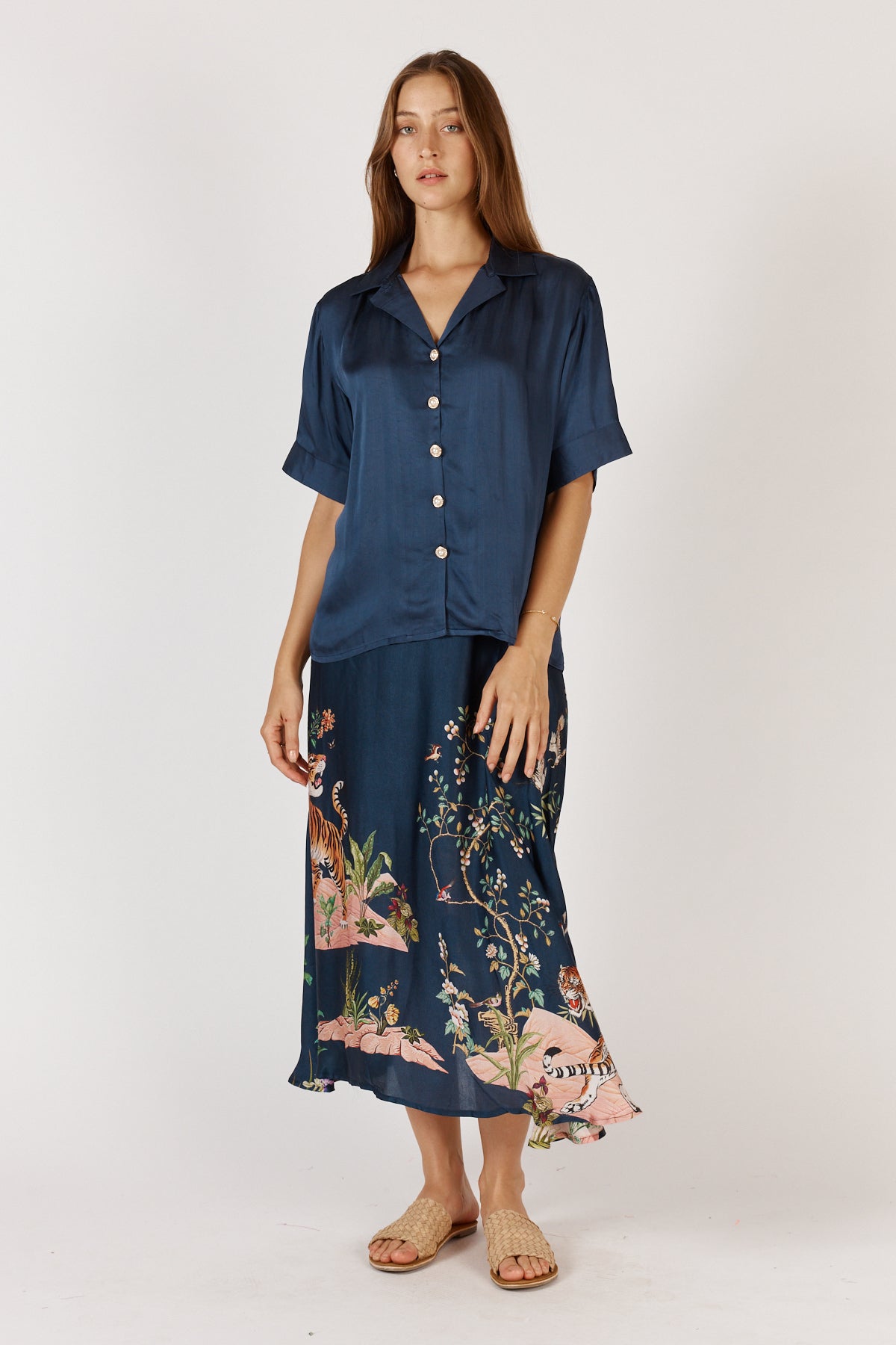 Woman wearing Satin Georgia Shirt with classic collar, button up front, short sleeves and straight hem by Rubyyaya.