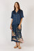 Woman wearing Satin Georgia Shirt with classic collar, button up front, short sleeves and straight hem by Rubyyaya.