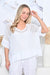 Woman wearing Cotton Net Top with singlet / cami with short sleeves in White by Cali&Co.