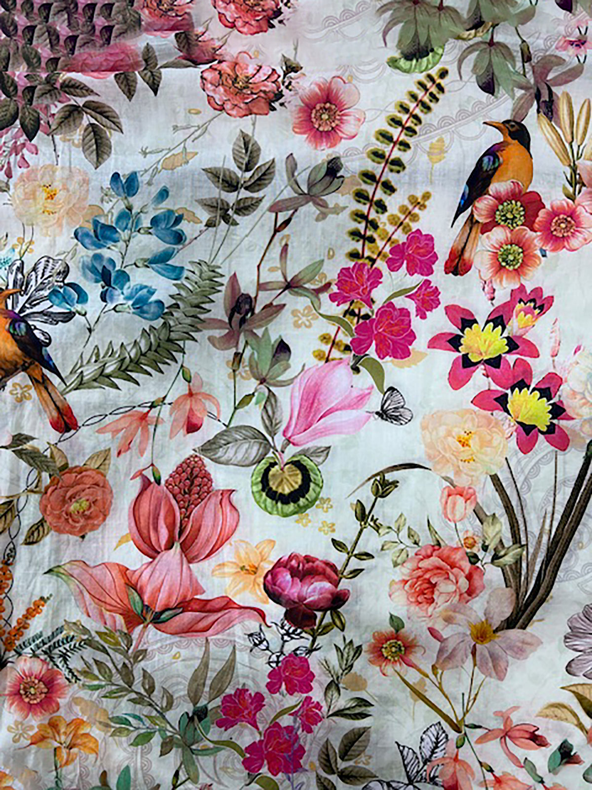 Close up of Cienna Kerala floral print, its a  white dress with birds and delicate flowers in pink, red, blue, yellow orange.