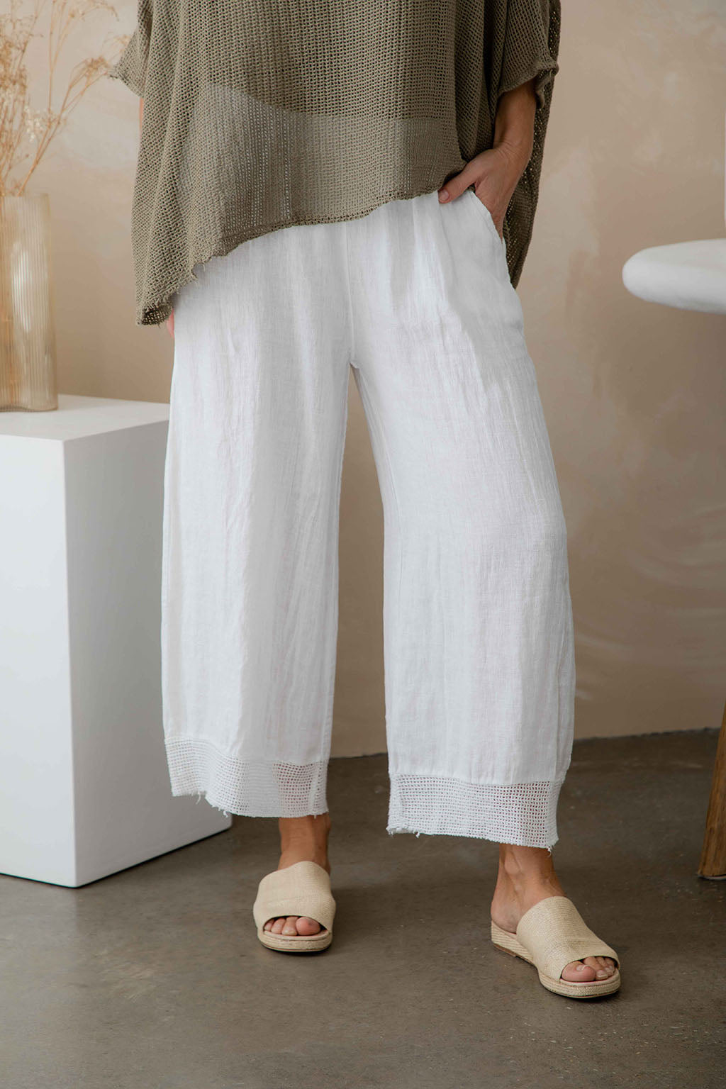 Ladies pineta white linen pants with open weave hem by The Italian Cartel.