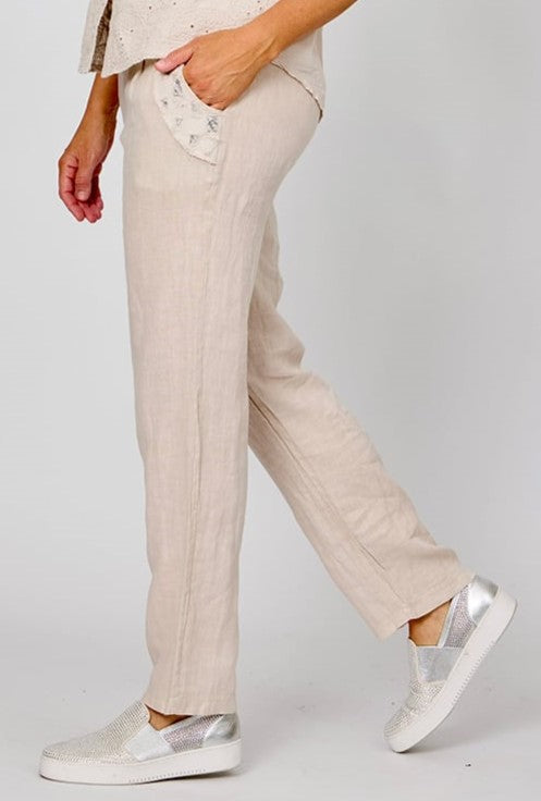 woman wearing the la strada beige blink pocket patch pants, full length with a straight leg.