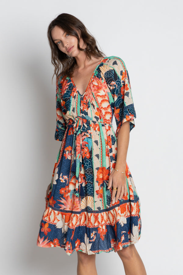 Woman wearing the Oriental inspired Wazuka Tie Midi Dress with V-Neck Short sleeves and a ruffle hem by LulaSoul.