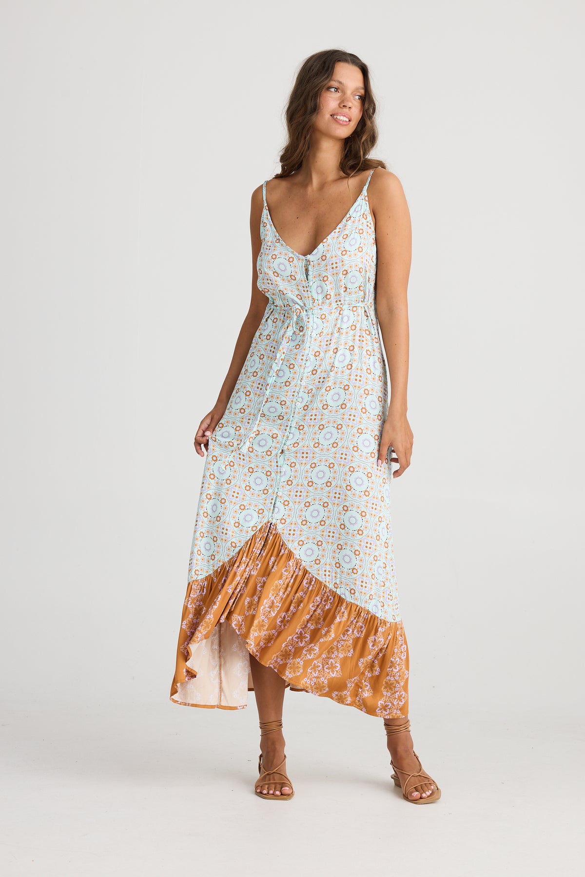 Long Dress with sleeveless strappy top, V-neck with a long ruffle along the hem.